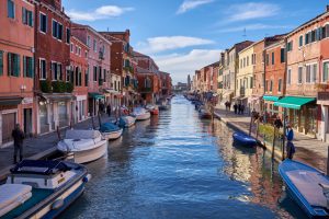 Things to see in Amsterdam include the centuries old canals, which sometimes look like Venice.